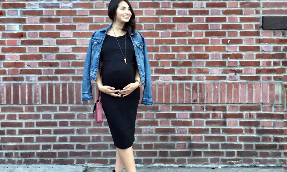 Pregnant woman wearing black dress